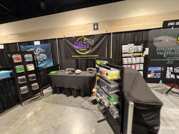 Reel Hostile Lures and Line-Sided Tackle Co. set up their booth displays ahead of the Florida Fishing Expo show floor opening.