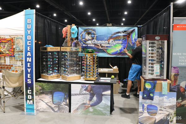 The Ocean Eyes (BuyOceanEyes.com) booth sets up its polarized sunglasses display ahead of the Florida Fishing Expo doors opening.
