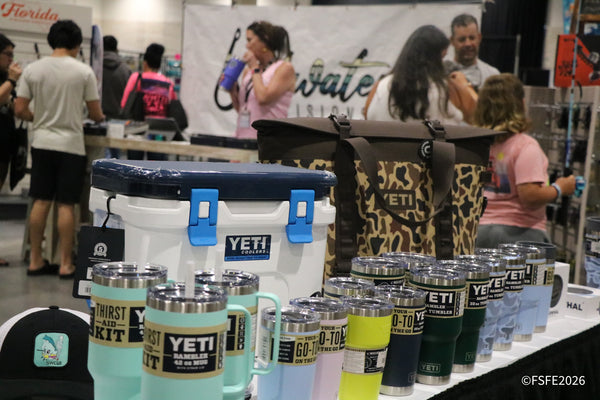 A colorful lineup of YETI coolers and Rambler tumblers on display for shoppers at the Florida Fishing Expo.