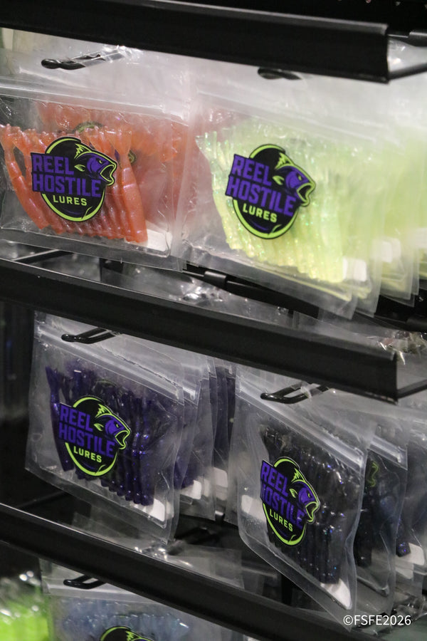 Rows of colorful Reel Hostile Lures soft plastics packed and ready for anglers at the Florida Fishing Expo.