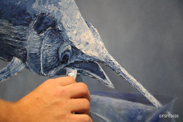 A live marlin painting demonstration captivates onlookers at the Florida Fishing Expo.
