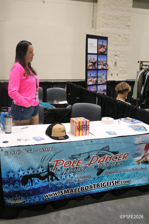 Pole Dancer Fishin' Charters runs a raffle at their Daytona Beach inshore fishing guide booth at the Florida Fishing Expo.