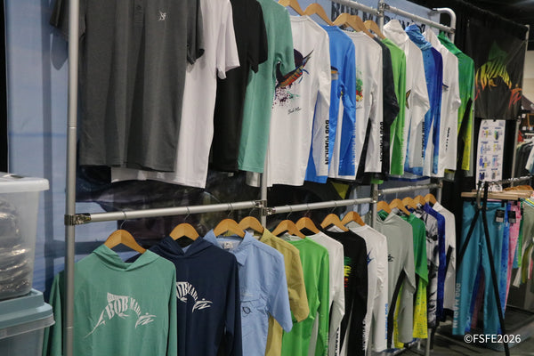 A rack of colorful Bob Marlin performance fishing apparel on display at the Florida Fishing Expo.