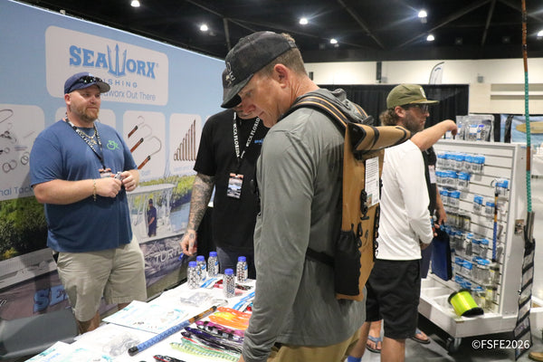 Anglers check out gaffs and lures at the SeaWorx Fishing booth at the Florida Fishing Expo.