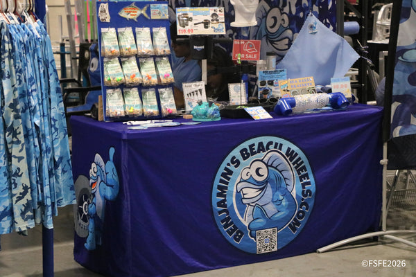 Benjamin's Beach Wheels displays pompano rigs, rod holder caps, and beach gear at their colorful Florida Fishing Expo booth.