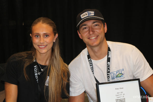 Ricky's Tackle vendors share big smiles at their Florida Fishing Expo booth.