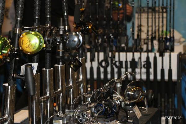 Rows of premium Okuma reels and rods gleam at the tackle display, a highlight of gear at the Florida Fishing Expo.