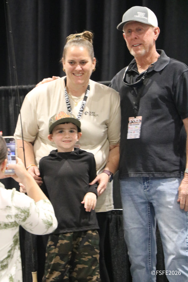 A family poses together for a keepsake photo at the Florida Fishing Expo.