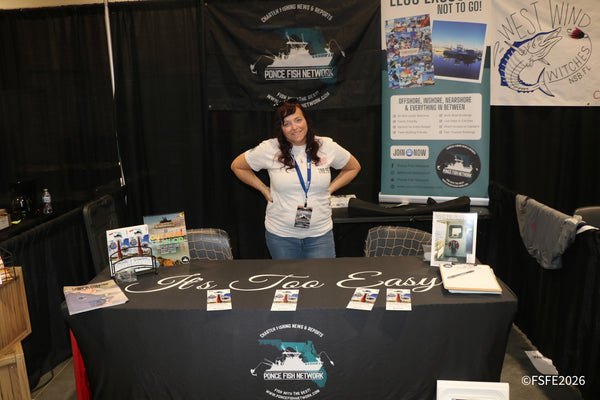 The Ponce Fish Network vendor smiles behind her charter fishing booth at the Florida Fishing Expo.
